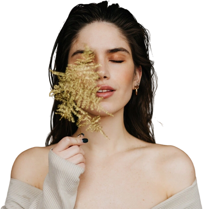 Glad European lady with nude makeup posing with plant glamorous brunette female