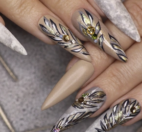 Manicure sharp shape nails with pattern leaves with rhinestones